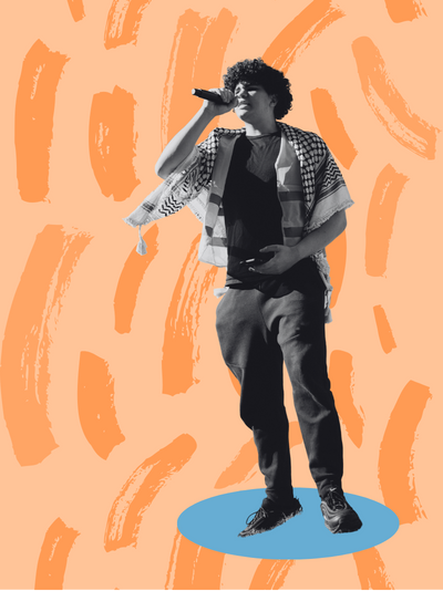 A black and white image of a young medium skin man wearing a keffiyeh standing and talking into a microphone that he is holding.